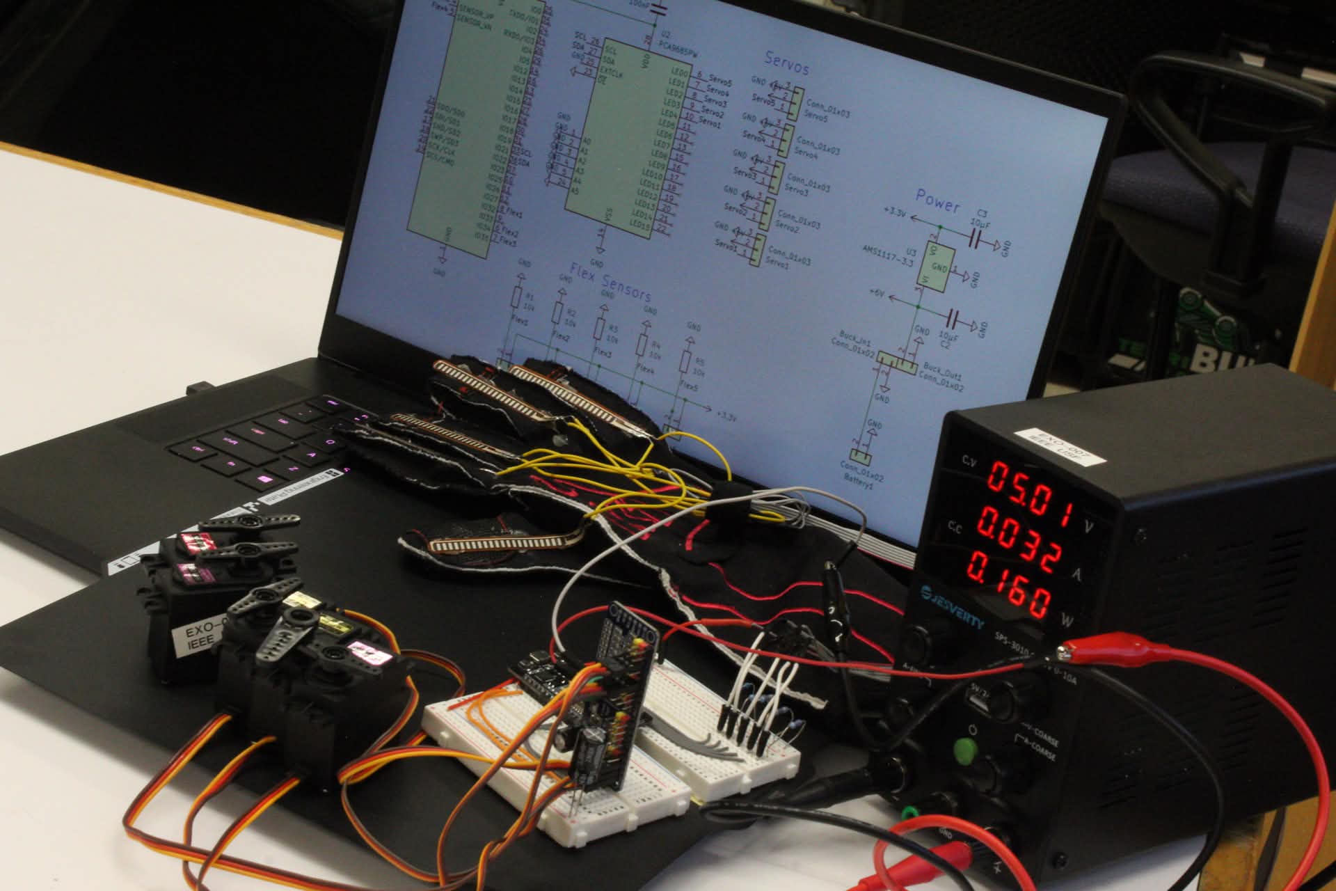 EXO mimetic glove prototype on a workbench with servos, breadboard controller, flex sensors, and a bench power supply, next to its circuit schematic
