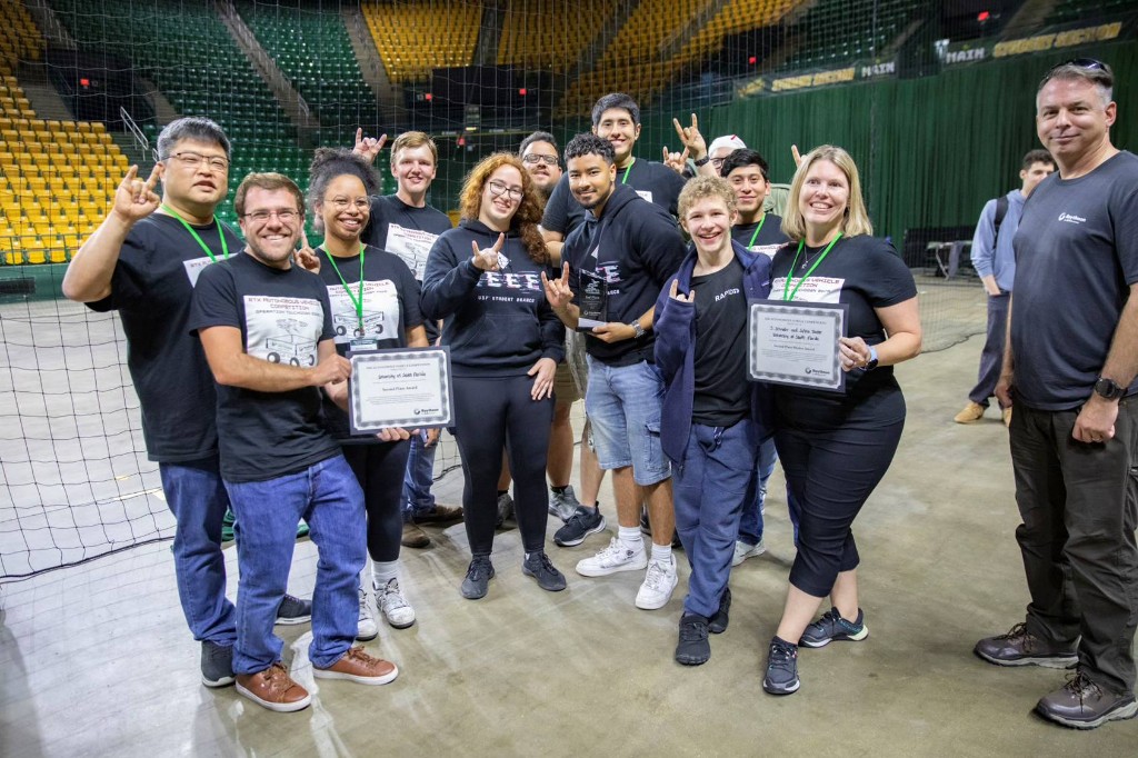 RAPTOR team celebrating its competition result with certificates and an award