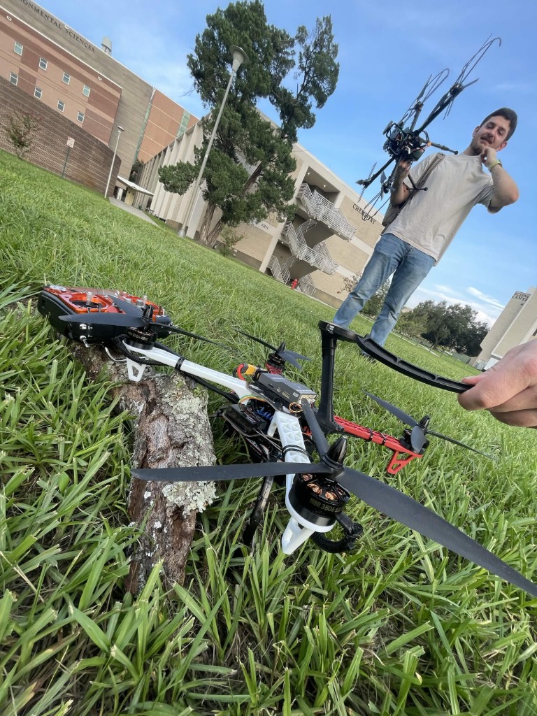 SWARM members field-testing multirotor drones outdoors at USF