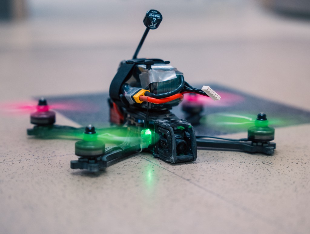 Compact SWARM FPV drone with illuminated motors and a front-mounted camera