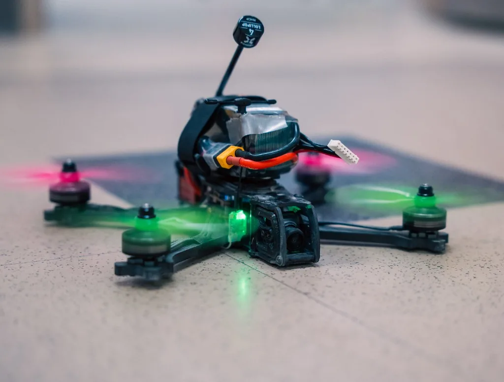 Compact SWARM FPV drone with illuminated motors and a front-mounted camera